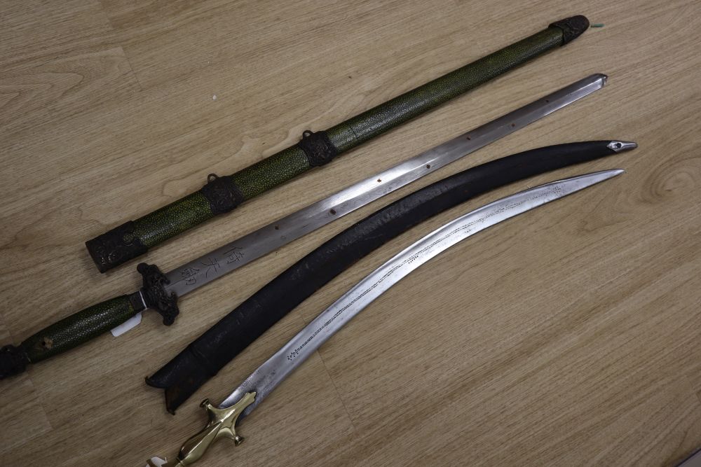 A Chinese sword, 30 inch straight double-edged blade with engraved script, shagreen grip, in shagreen scabbard, and one other sword,
